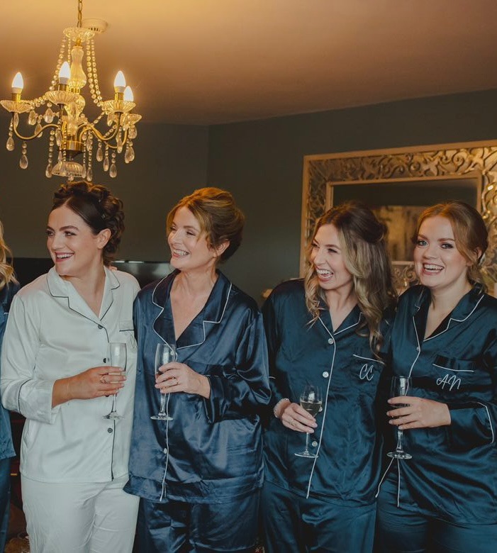 Happy bridal party on the wedding morning with wedding makeup done
