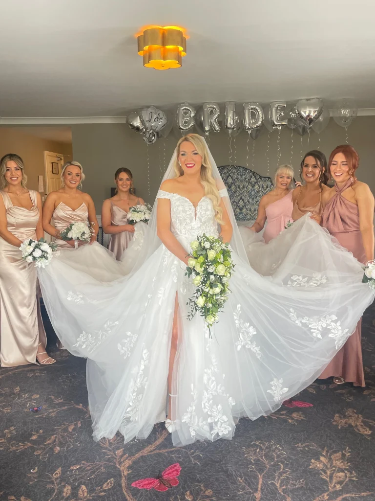 Bride posing with her fabulous bridal party