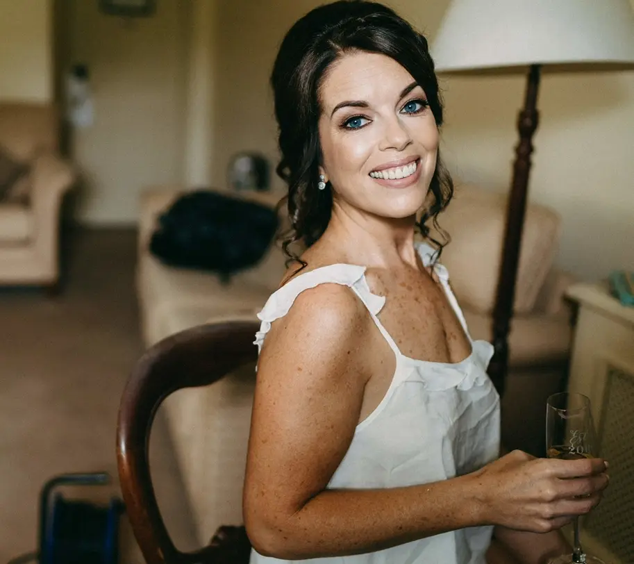 Bride with stunning blue eyes and soft makeup glam - cropped