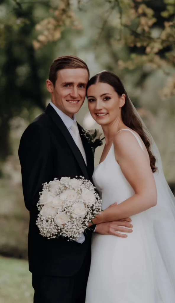 Bride and groom posing together on wedding day in Ireland