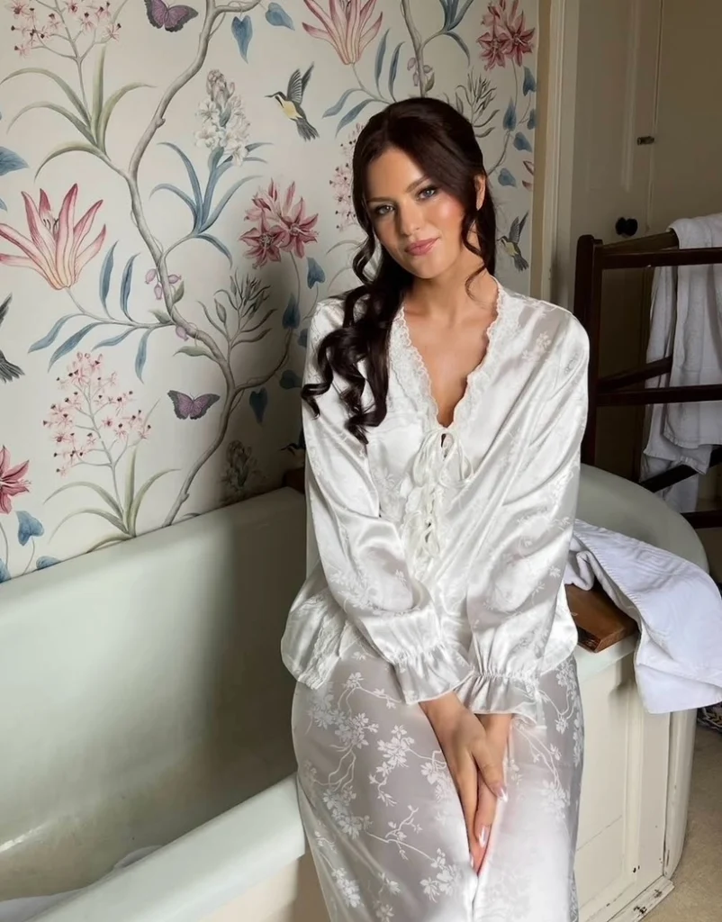 Gorgeous brunette bride in her pjs with her wedding makeup done