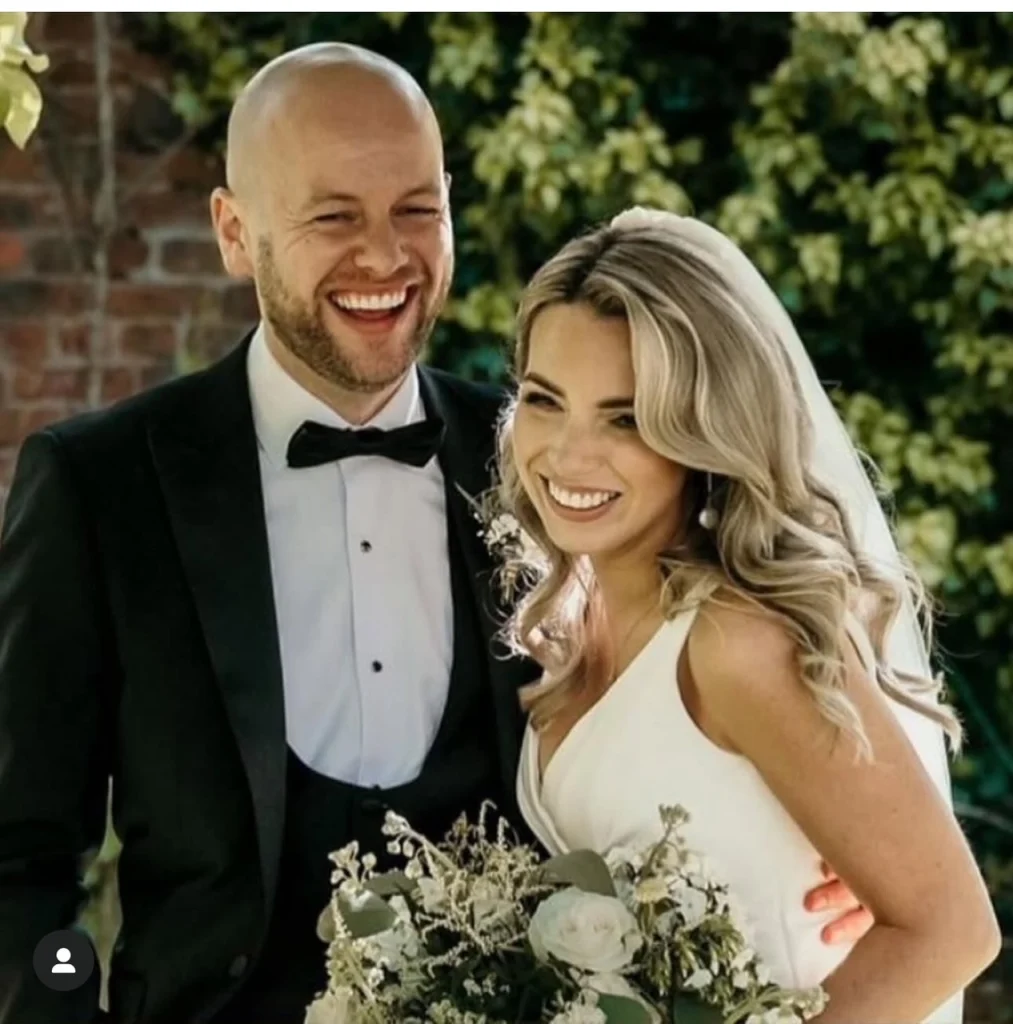 Smiling bride and groom