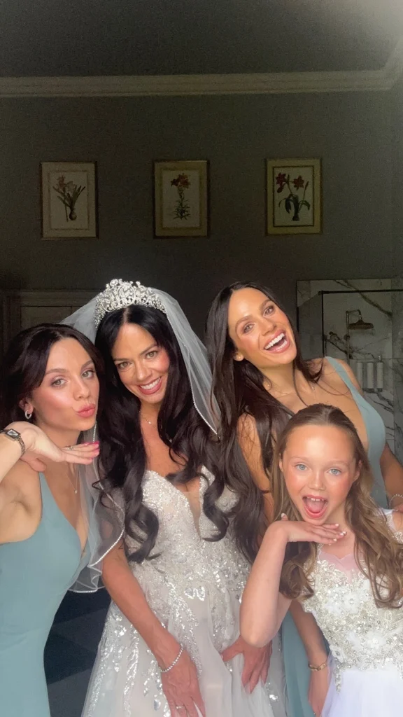 Fun bridal party posing in their wedding makeup looks