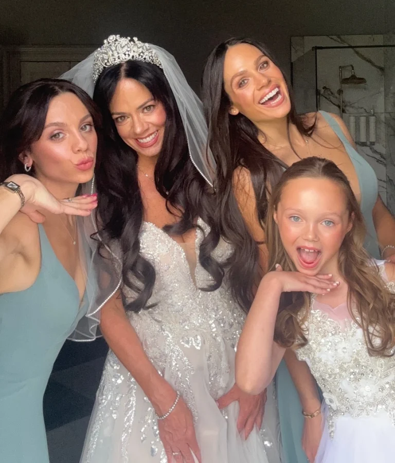Fun bridal party posing in their wedding makeup looks