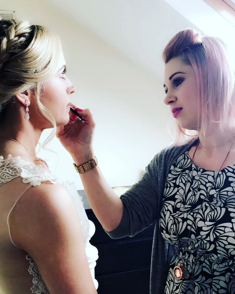 Makeup artist in Dublin, Nima, applying lipstick for bridal makeup