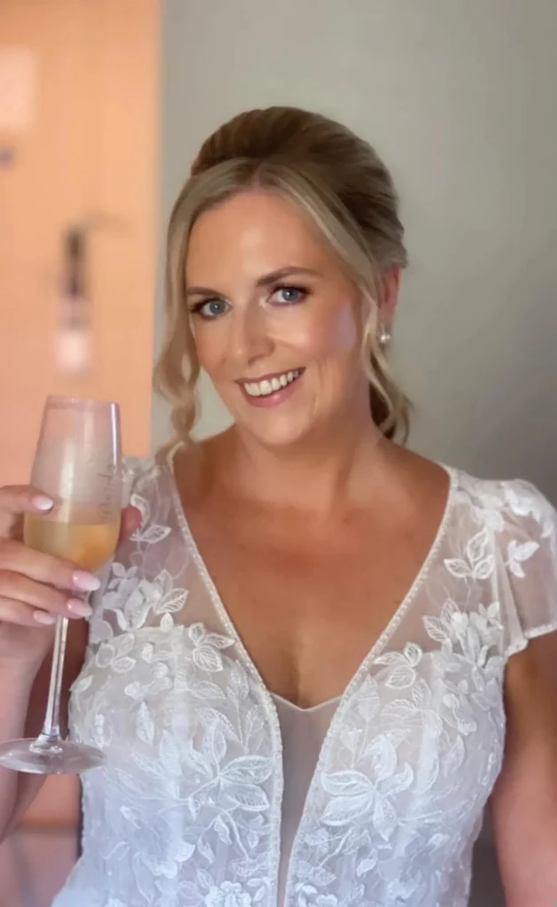Bride cheerings with champagne