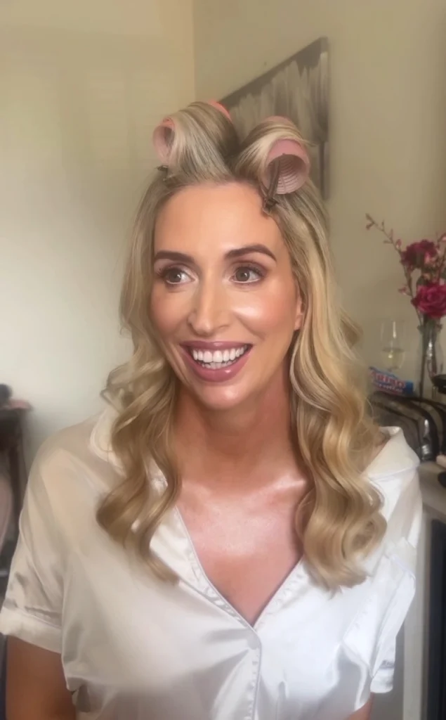 Smiling blonde bride with her wedding makeup compelet